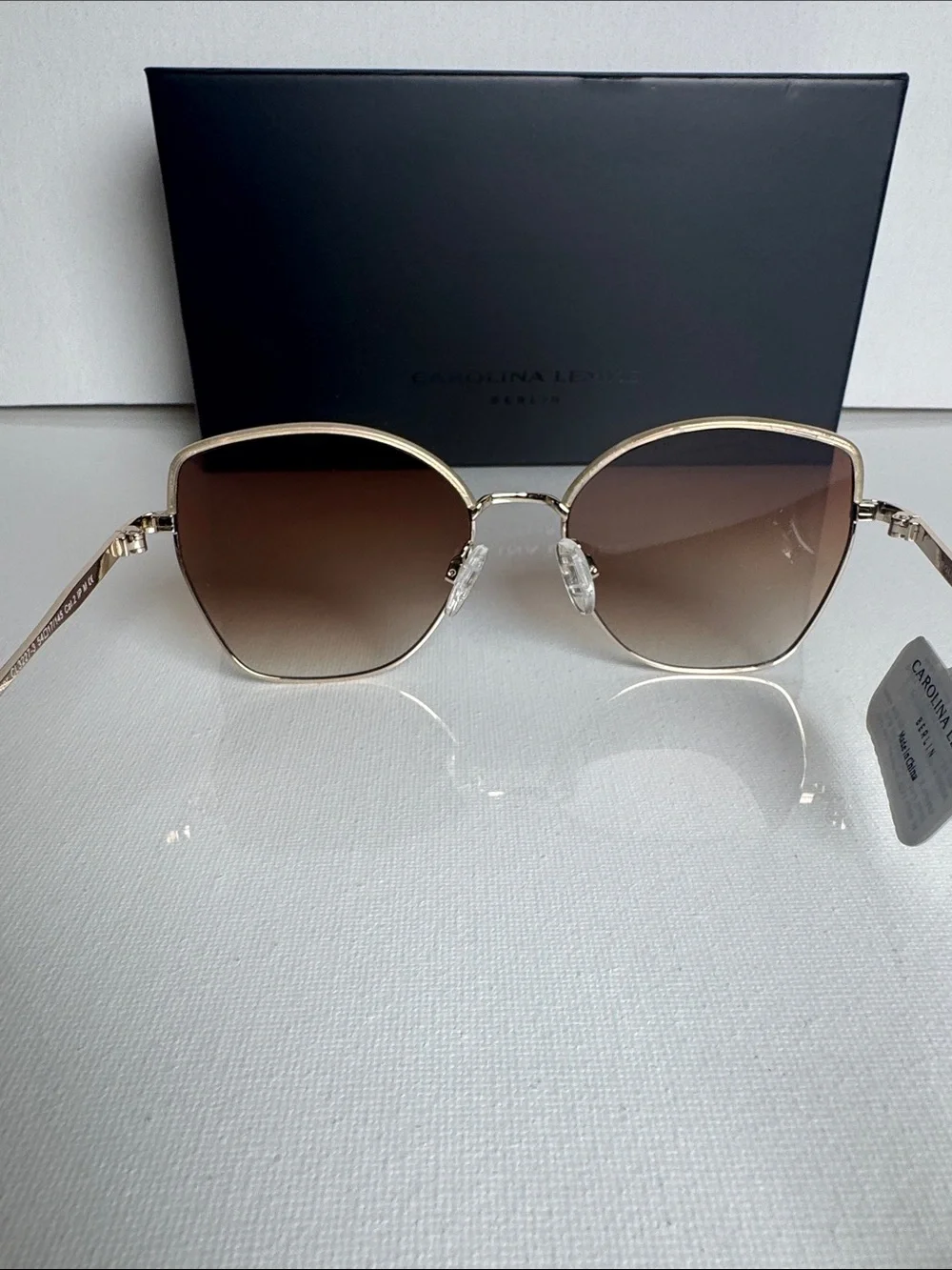 Carolina Herrera Gold Frame Sunglasses with Brown Gradient Lenses